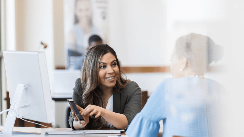 Female financial advisor consulting with a businesswoman about loan options in Puerto Rico.